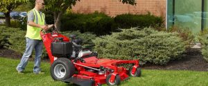 Man using a commercial lawn mower in salt lake city