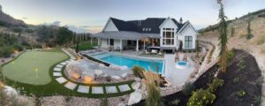 Luxury backyard design, pool installation, putting green construction, outdoor fireplace, landscaping ideas, backyard oasis, dream home features.