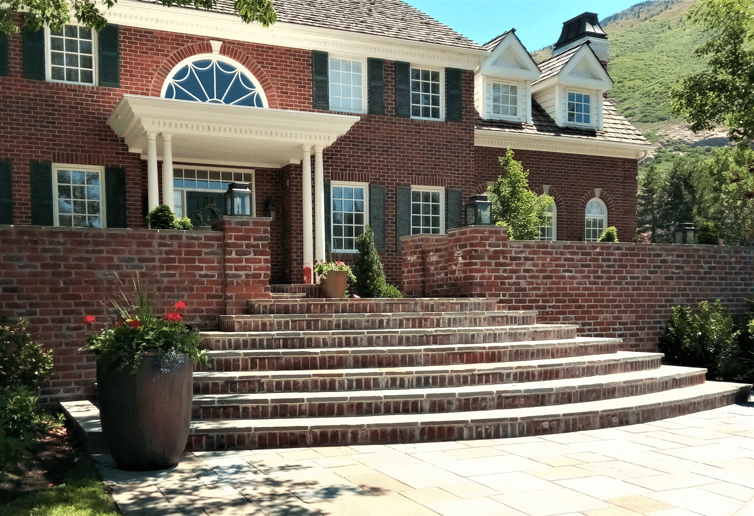 A wide-angle shot of a charming historic home in Salt Lake City (brick or stone façade)