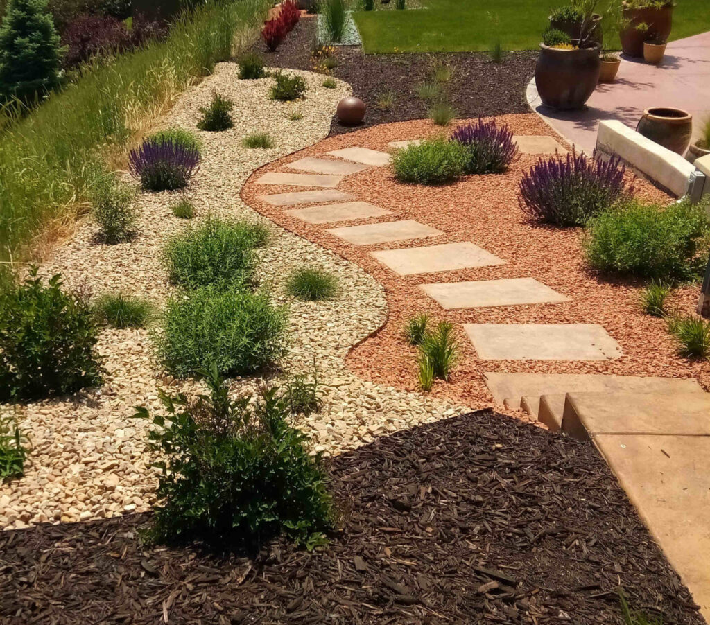 A mature, beautifully established Herriman Utah landscape featuring drought-tolerant shrubs, ornamental grasses and perennials thriving in alkaline Utah soil