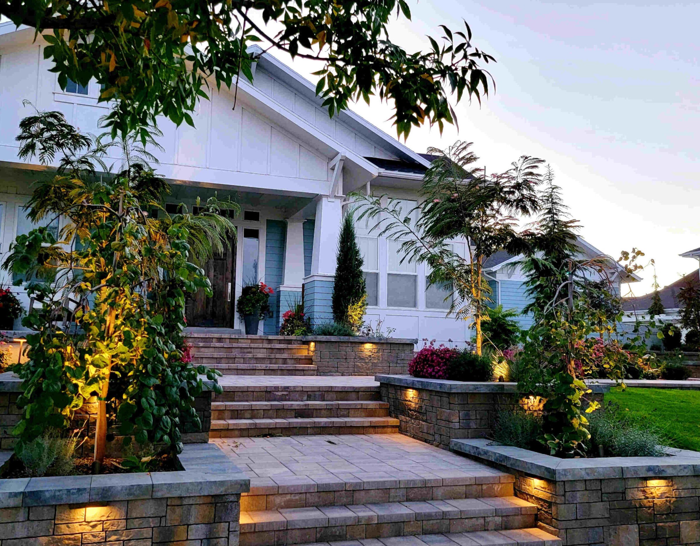 LED step lights and pathway lighting illuminating outdoor stairs and walkway in a South Jordan Utah backyard at dusk for safety