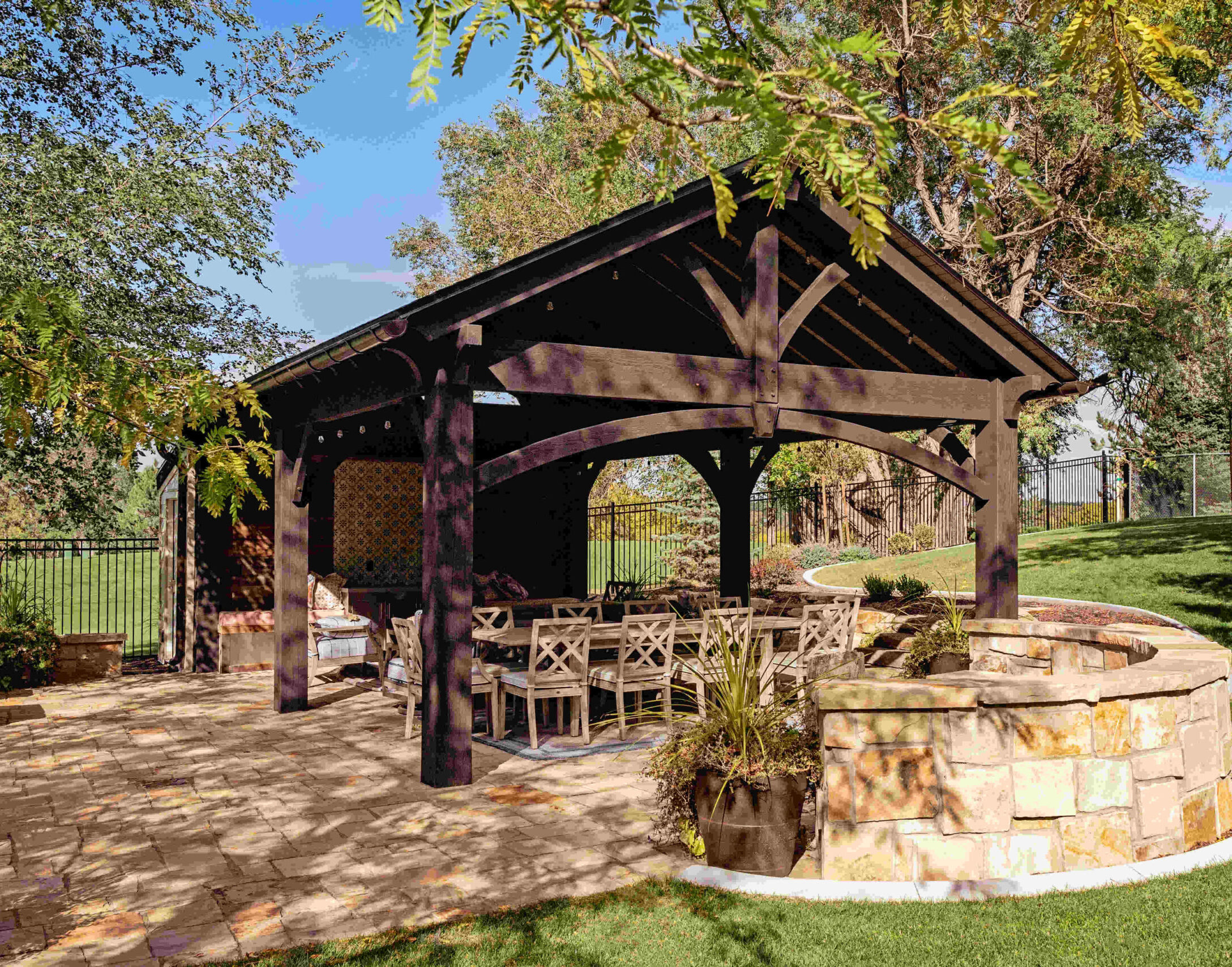 Terraced retaining wall and landscape design on a sloped Bluffdale Utah residential property with native plantings