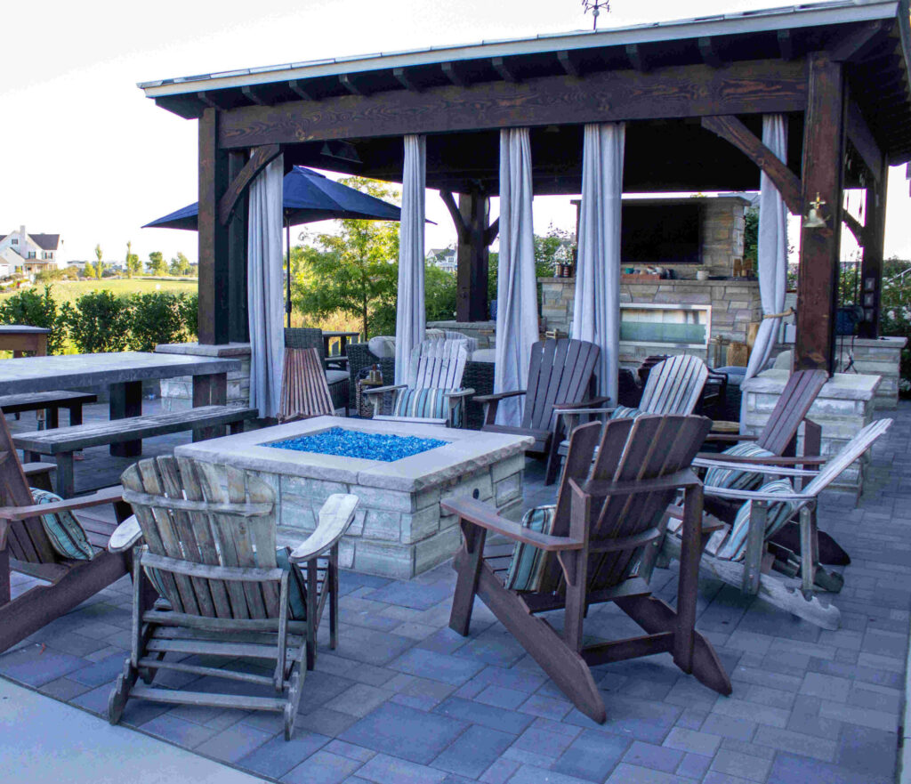 Custom patio pergola and outdoor kitchen design in Bluffdale Utah by Millburn Lawn & Landscape