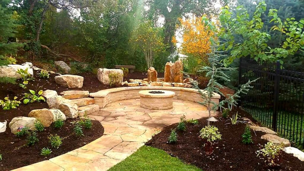 Homeowner reviewing a phased landscape installation budget plan with a contractor in Bluffdale, Utah