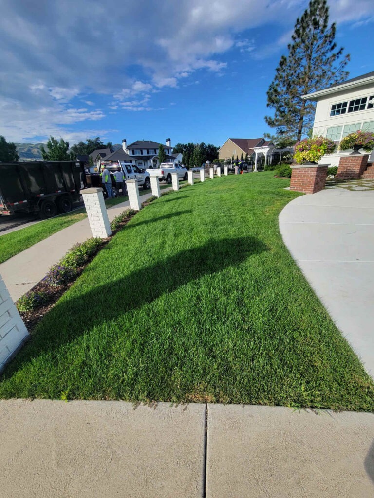 Professionally maintained front lawn and residential landscape by Millburn Lawn & Landscape in Eagle Mountain, Utah.