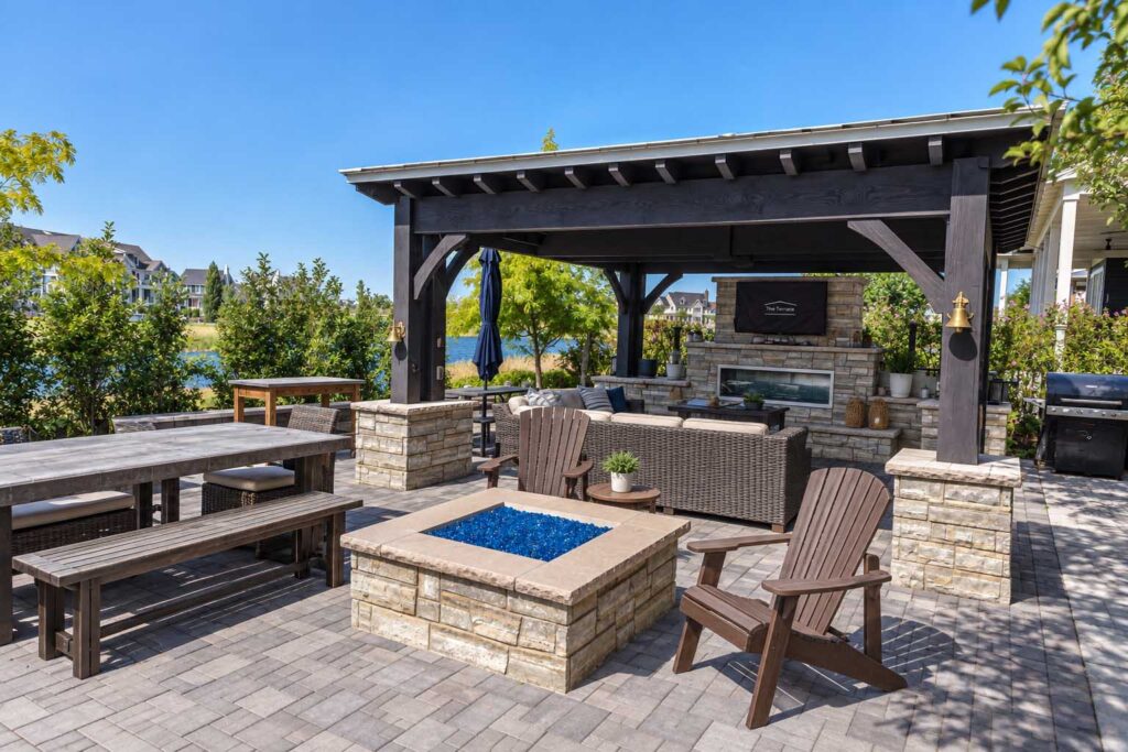 Finished outdoor kitchen patio design in Millcreek Utah backyard coordinated with kitchen remodel indoor-outdoor connection